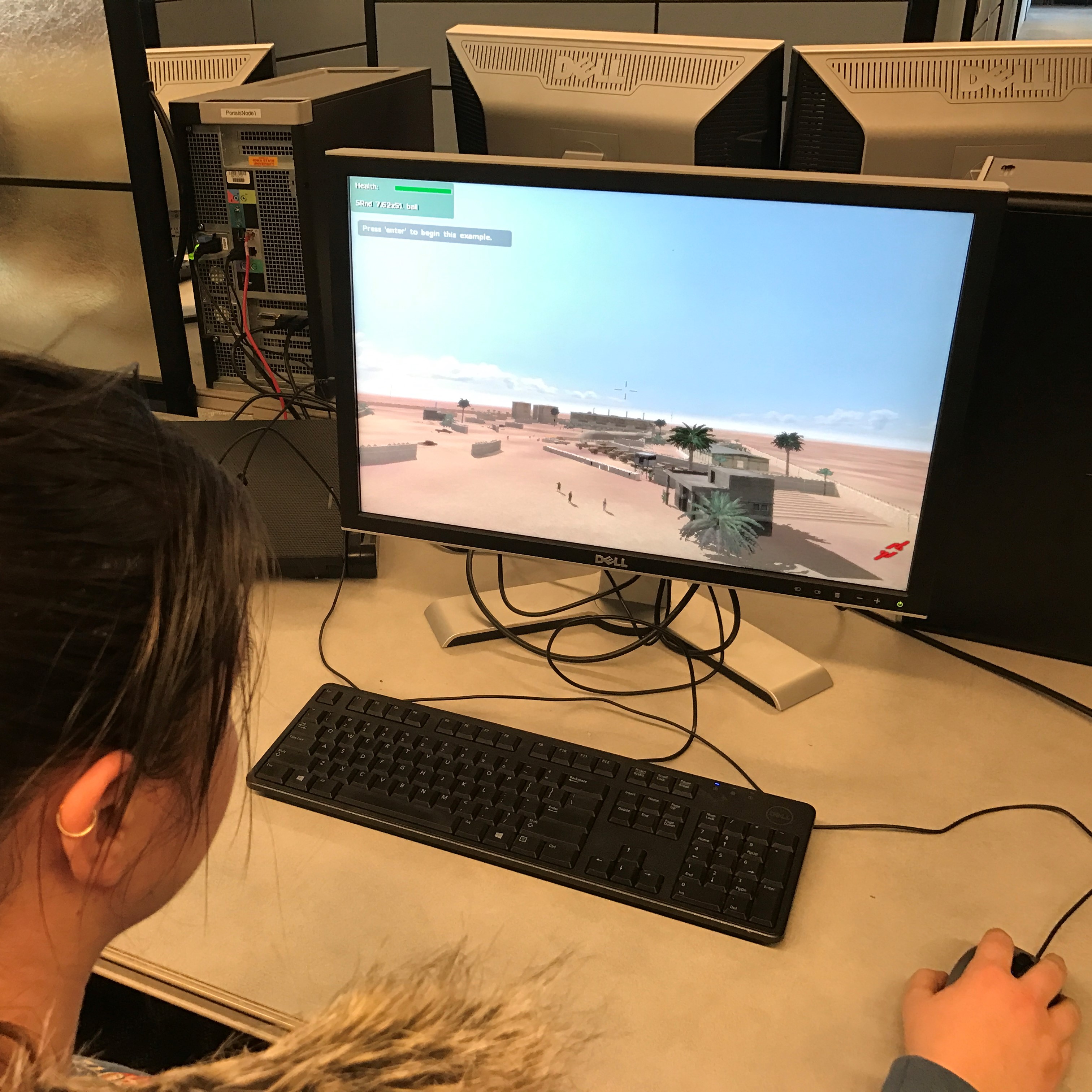 Kaitlyn interacting with the serious game environment used during player testing.
